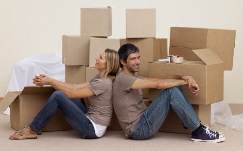 Careful unloading of boxes and furniture at a Creekmouth property