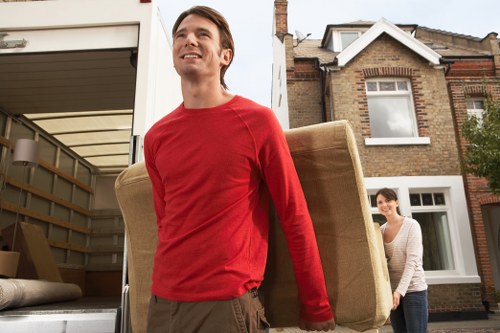 Packed household boxes and furniture ready for transport