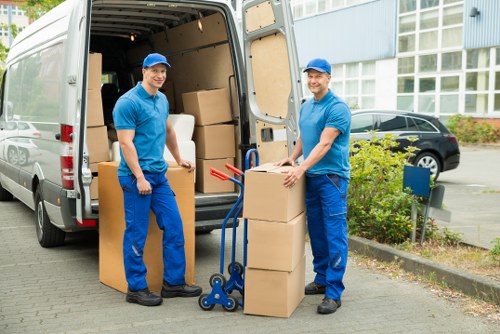 Office furniture and equipment being prepared for a commercial move