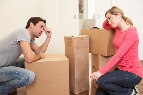 Loading furniture and boxes into a moving truck in Creekmouth