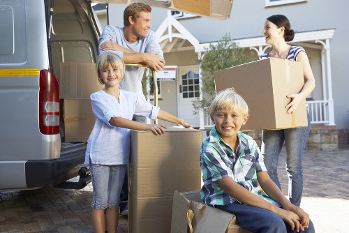 Professional movers handling office equipment in Creekmouth