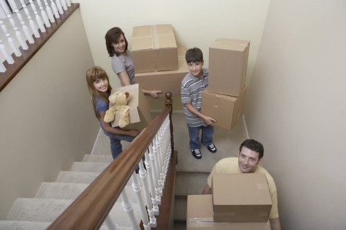 Removal team handling household furniture during a Creekmouth relocation